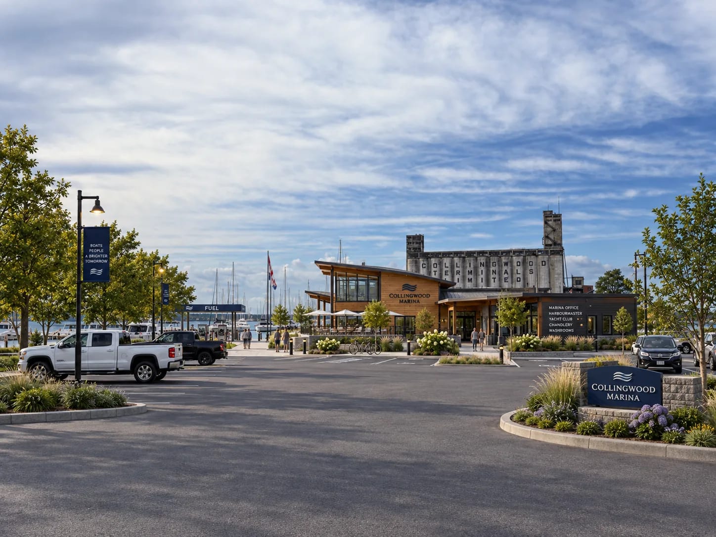 A marina office and service building at the foot of the harbour road, with the grain terminals rising directly behind it.